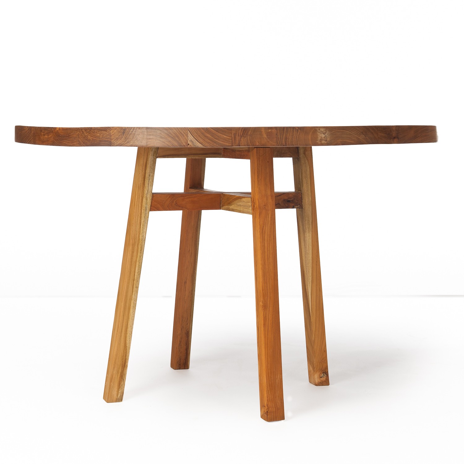 A round wooden table with four angled legs on a plain white background, warm brown tones